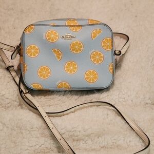 COACH mini camera bag with orange print